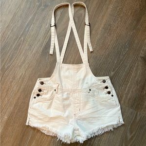 Free People cut-off short overalls.